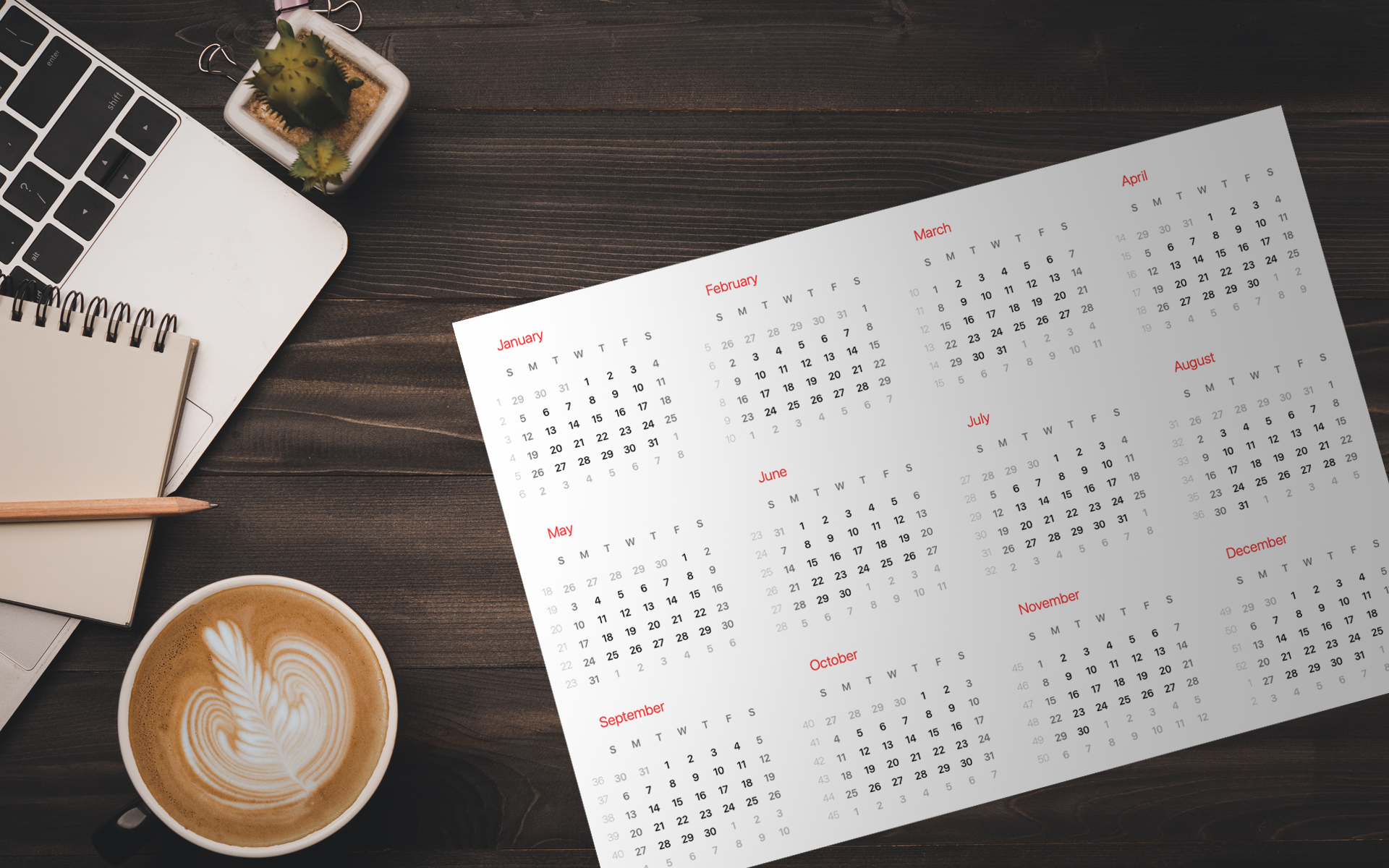 Desk with Computer Calendar Coffee and note pad